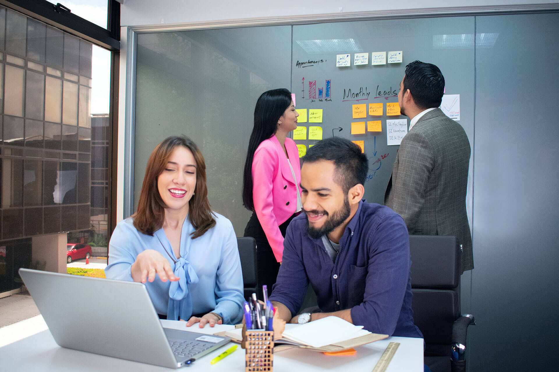 Team of skilled virtual assistants collaborating at VOOV office.